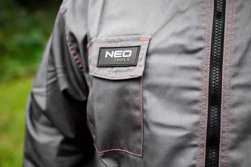 Neo Tools Munkavédelmi kabát, Basic, 35% pamut, 65% polyester, többfunkciós zsebek, gumírozott derék, CE EN341, L/52